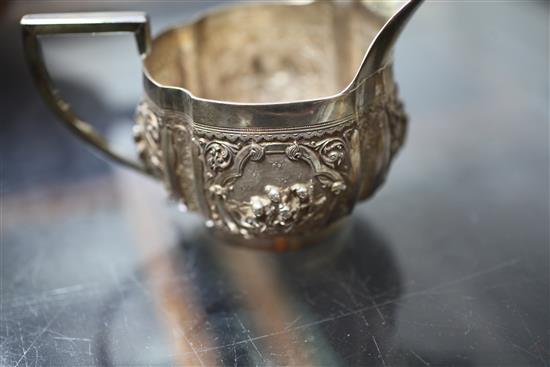 A heavy late 19th century Indian three piece silver tea set,
